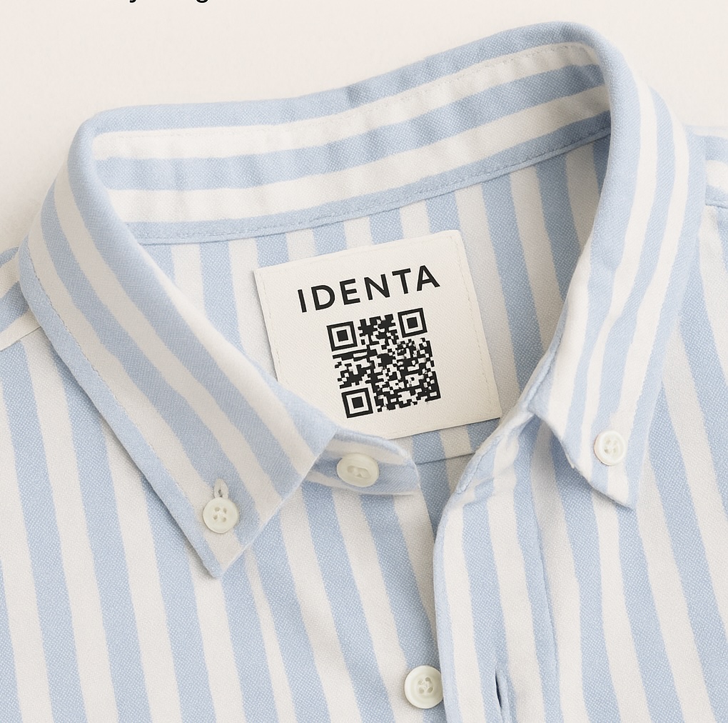 Close-up of a striped shirt collar with an Identa QR code tag